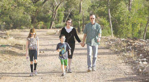 Brock Belnap, right, walks with his wife Chantie and their children, Grace, left, and Noah on the Confluence Trail during the official opening.